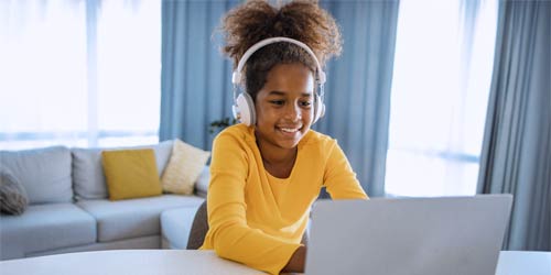 Girl browsing the internet on a laptop